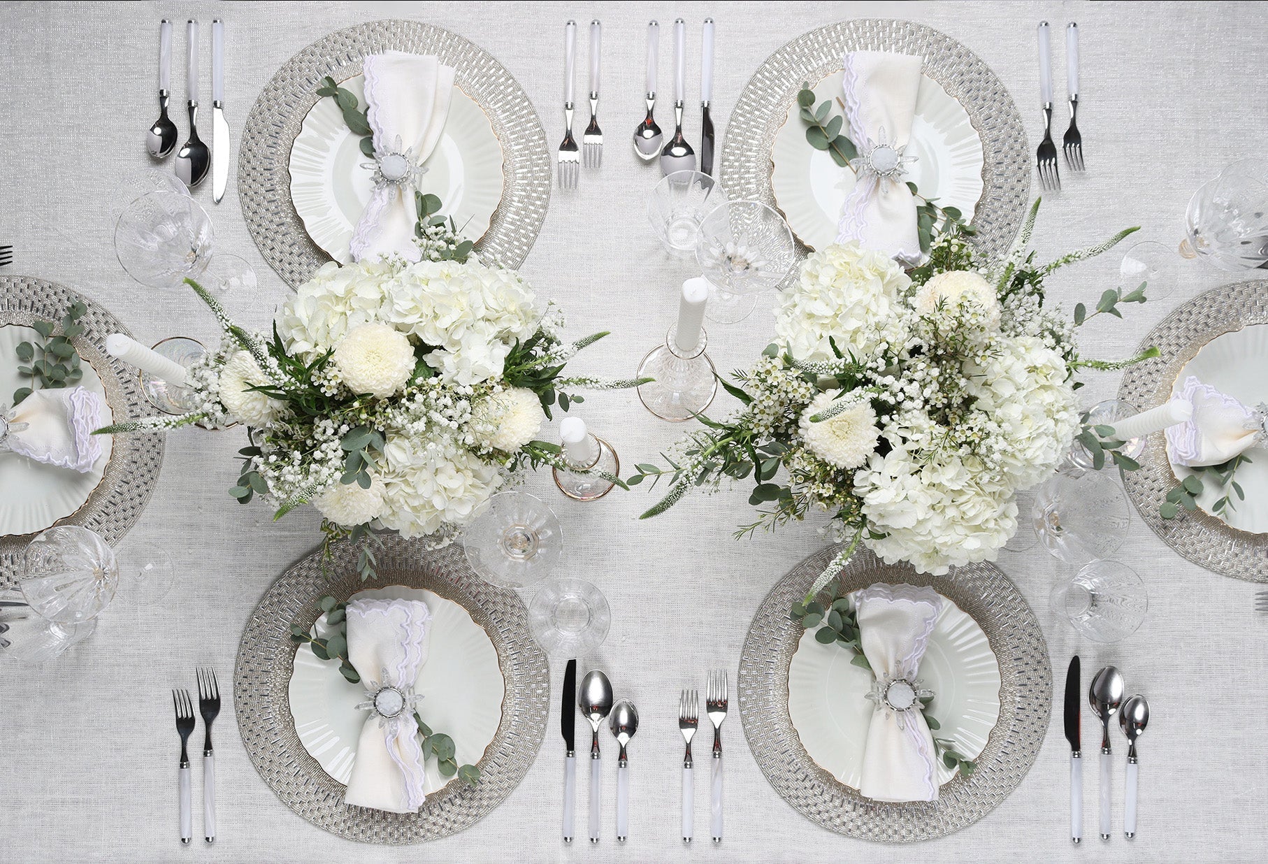 Elegant flatware and silverware settings styled on a formal dining table with modern tableware