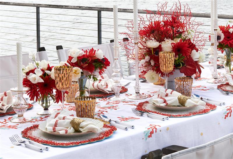dinner party idea for table setting with coral, gold, and coastal decor
