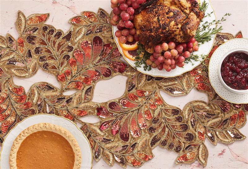 luxury thanksgiving dining table with leaf table runner and beaded placemats styled by Kim Seybert
