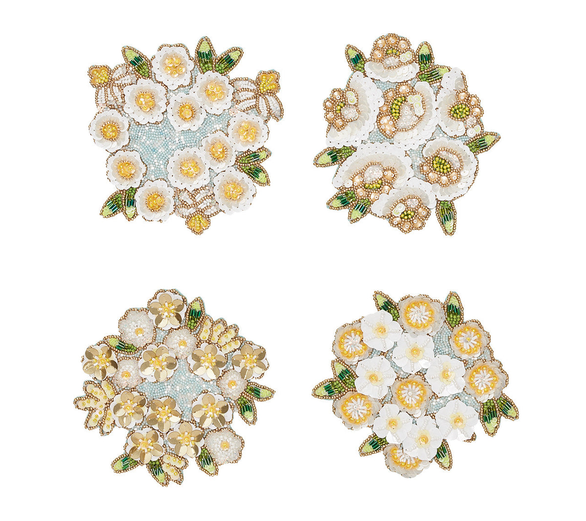 Set of four beaded Kim Seybert Luxury Gardenia Drink Coasters in Sky, White, & Yellow