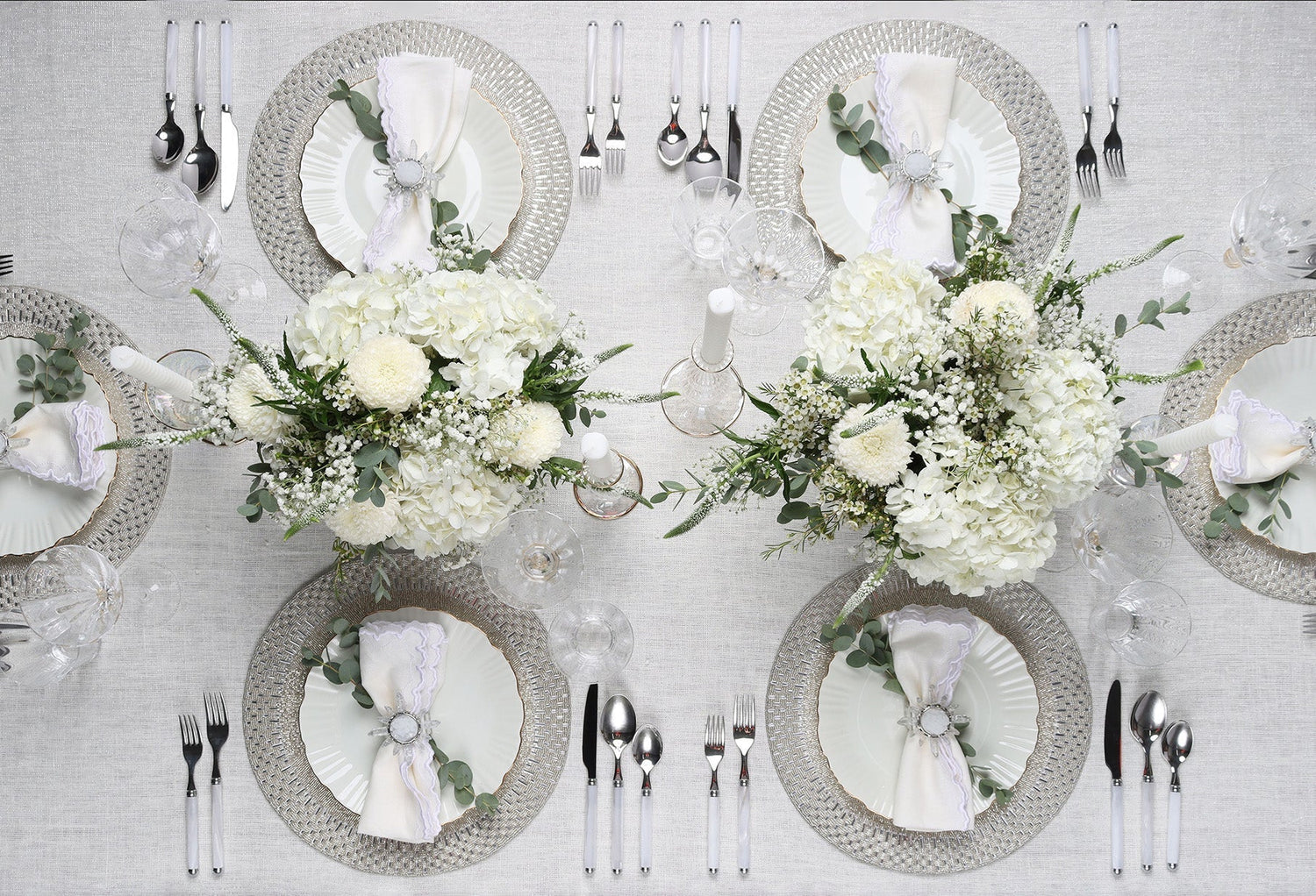 Elegant flatware and silverware settings styled on a formal dining table with modern tableware