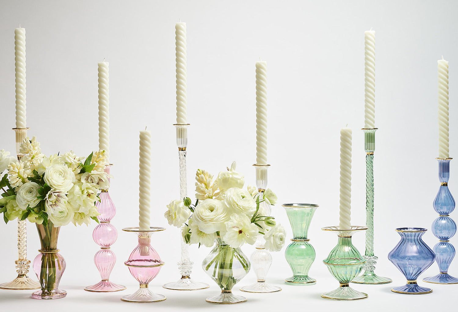 colorful glass vases in pink green and blue