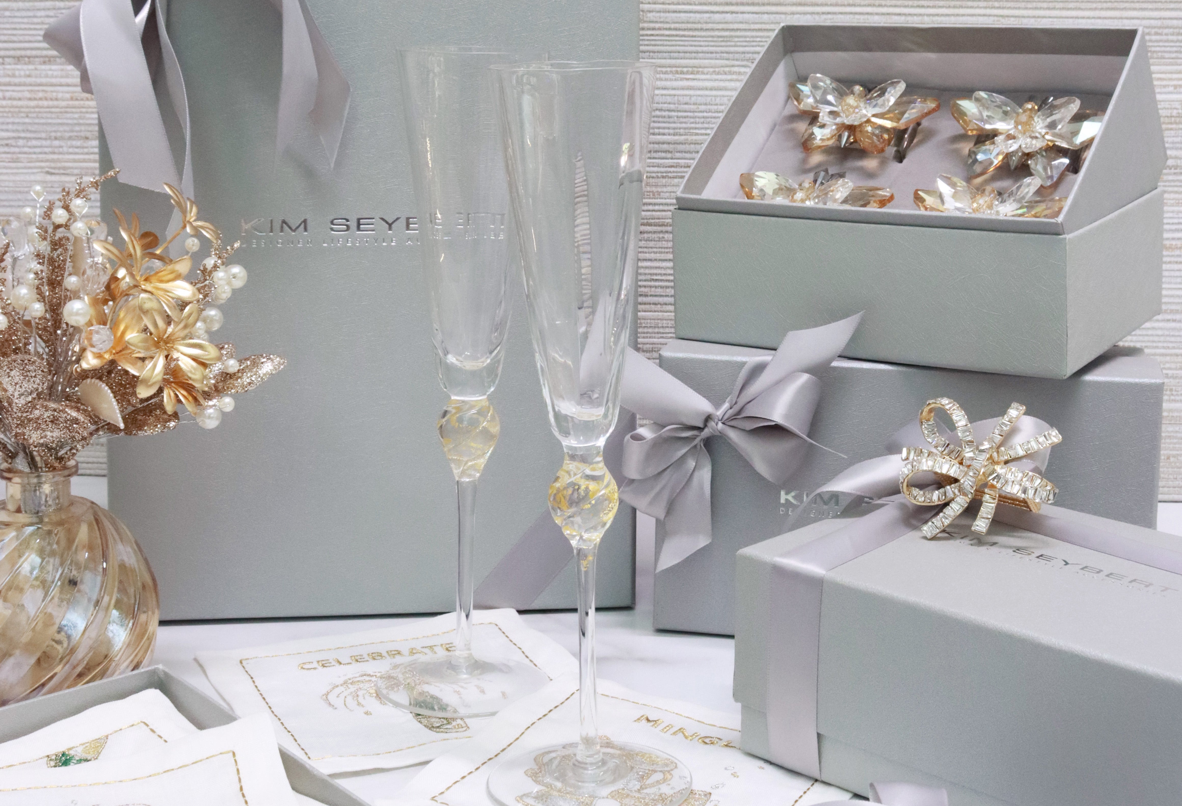 Holiday hostess gifts featuring Daphne champagne glasses and luxury gold centerpiece by Kim Seybert.