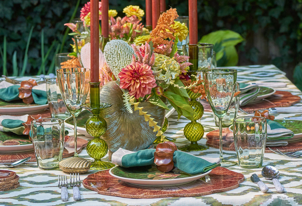 Luxury fall tablescape styled outdoors to match New England foliage, layered Kim Seybert table linens, candles, and seasonal decor.