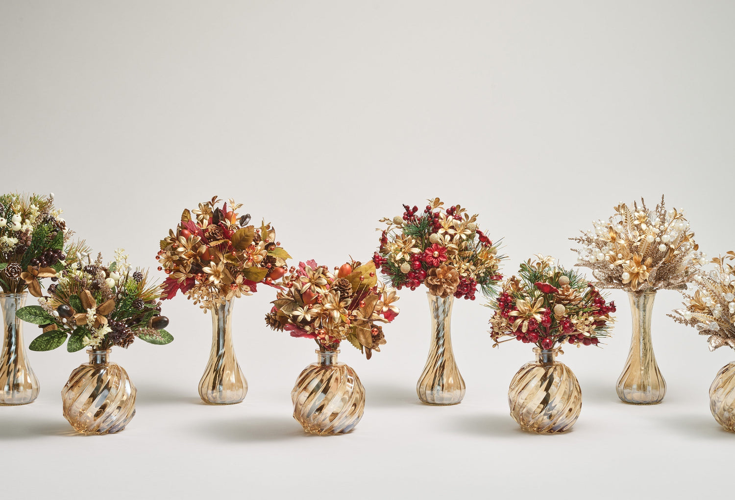 Kim Seybert luxury Thanksgiving vase centerpieces with amber, gold, and red faux florals in designer vases