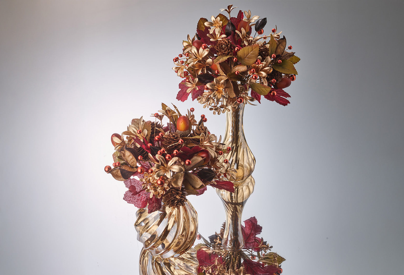 Kim Seybert luxury Thanksgiving vase centerpieces with amber, gold, and red faux florals in designer vases