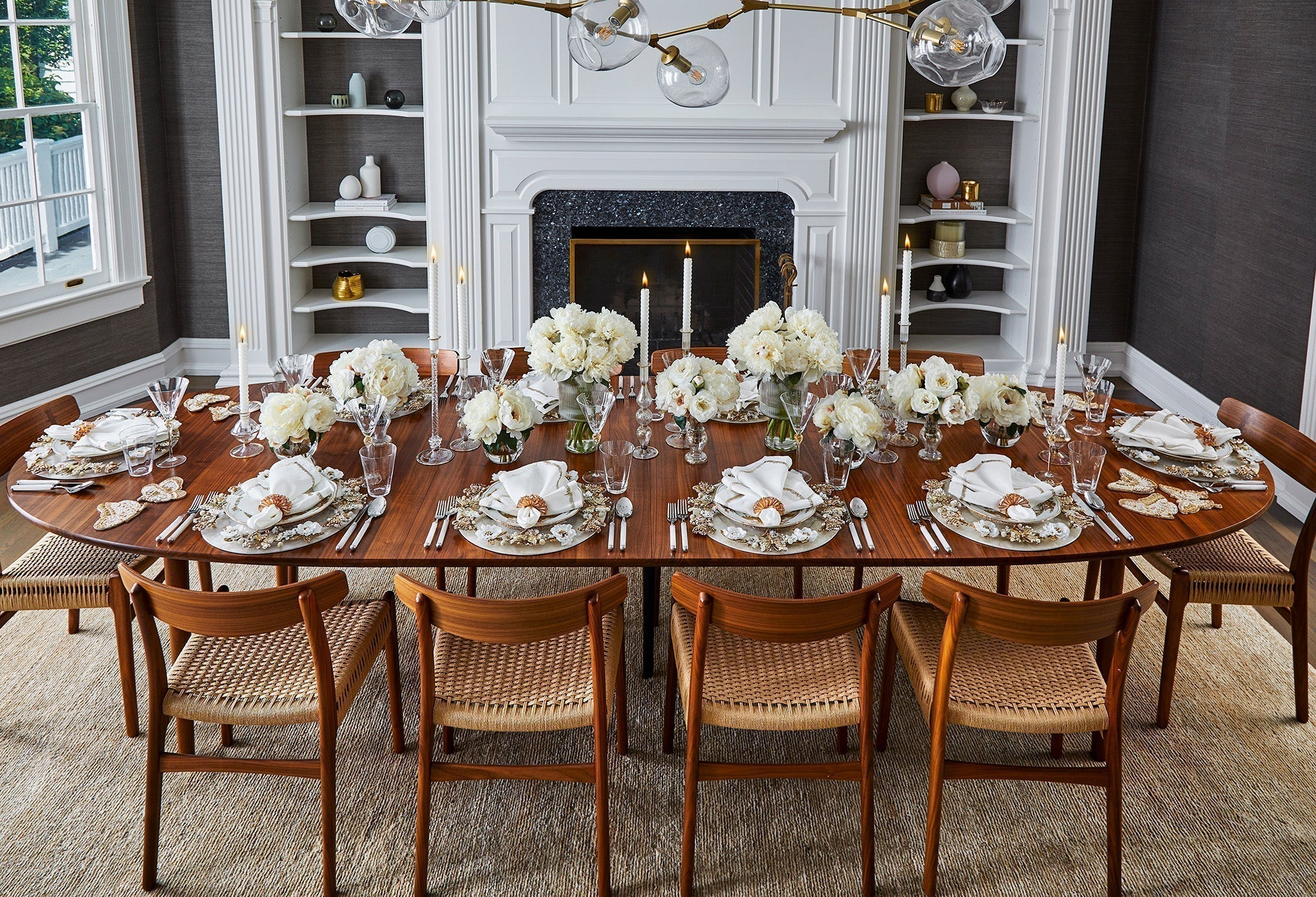 Minimalist Kim Seybert dining room with decorative wall vases styled on floating shelves