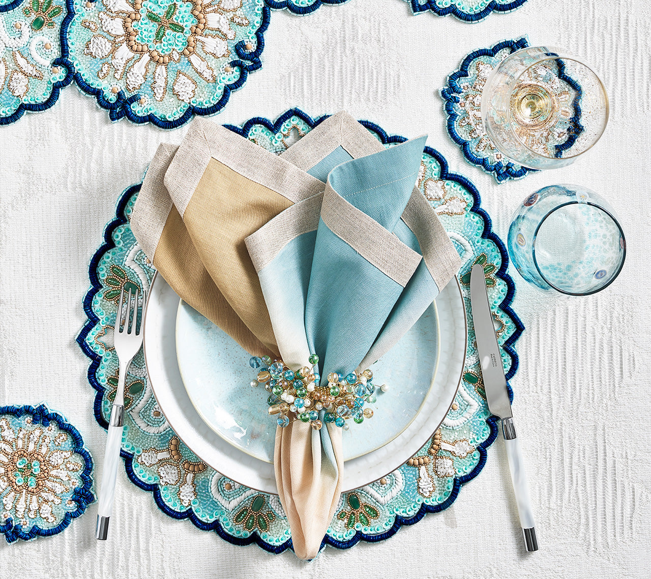 Kim Seybert's luxurious Lisbon Placemat, Table Runner and Drink Coaster Collection