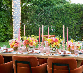 Outside table setting of Kim Seybert Luxury Knotted Edge Napkin in White, Natural & Orange