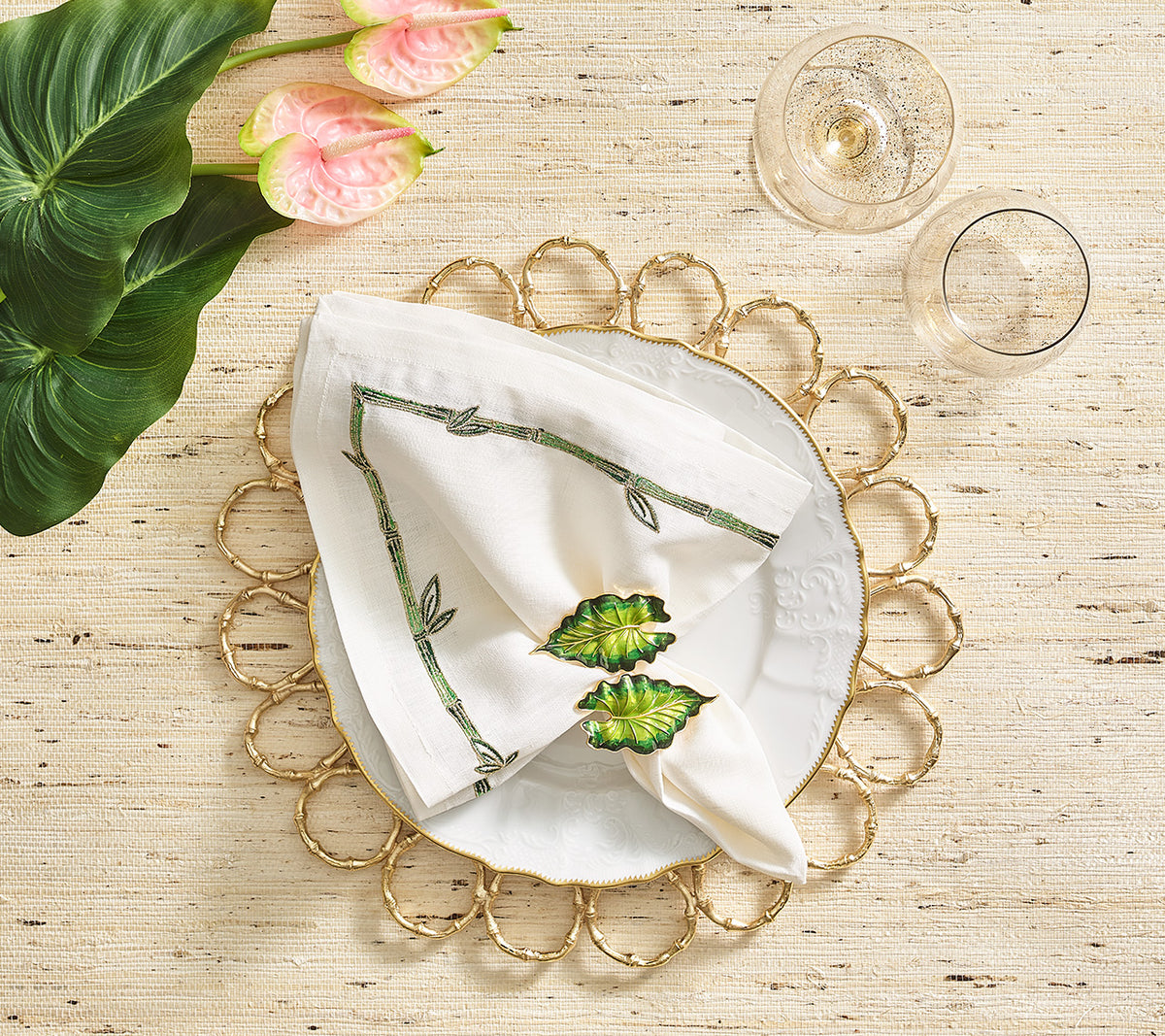 White Bamboo Napkin on top of a gold placemat
