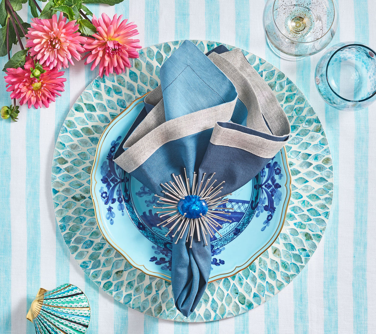 Seafoam Marquis Placemat underneath coordinating blue plates on seafoam & white striped tablecloth