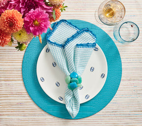 Round Croco Placemat with an embossed faux crocodile pattern in turquoise
