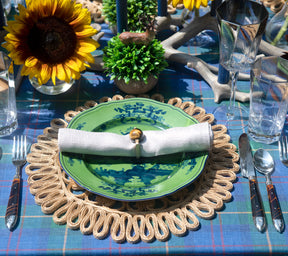 Green Oriente Italiano Dinner Plate, Malachite, in a summertime table setting wit sunflower in vase