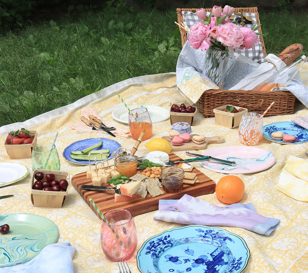 Outdoor picnic set up on top of the yellow Provence Tablecloth 
