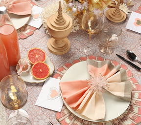 Table set with pink and gold accents and a Kim Seybert Luxury Dip Dye Napkin in blush & gold