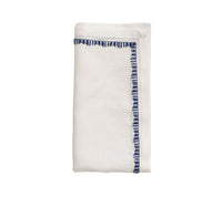 Kim Seybert Luxury Filament Napkin in white & navy, folded
