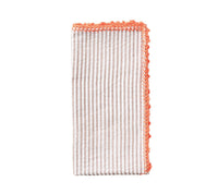 Kim Seybert Luxury Seersucker Napkin in natural & orange, folded