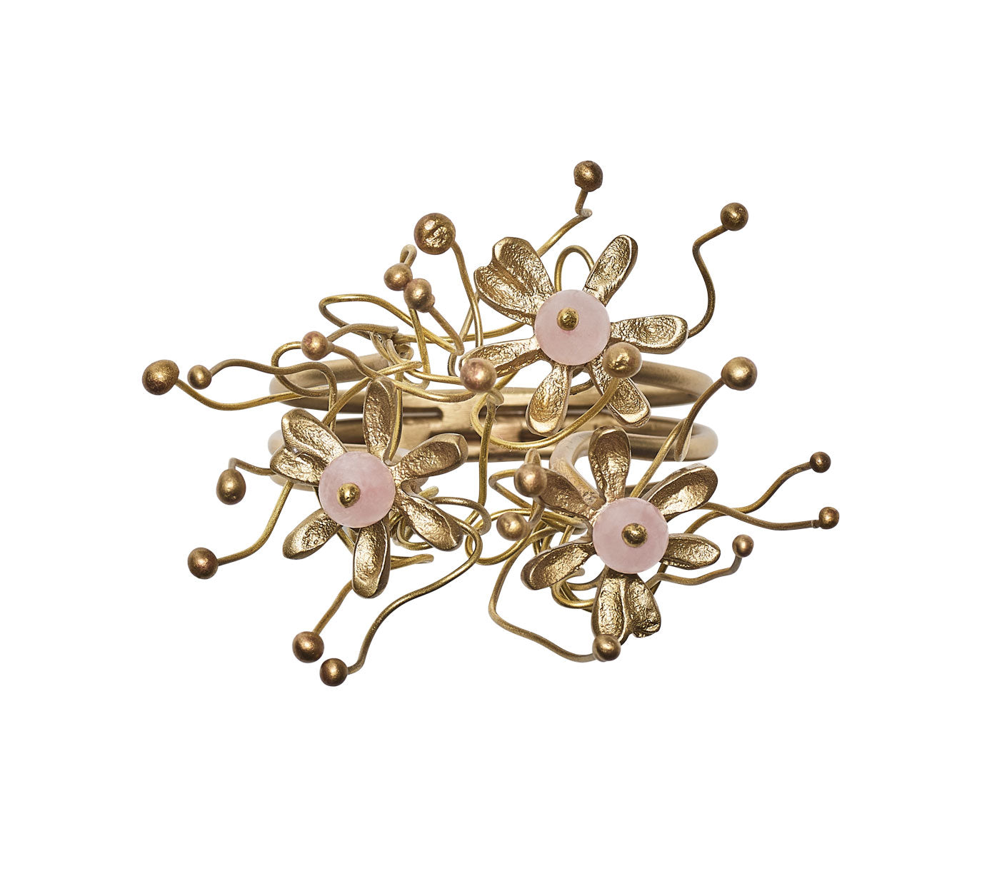 Close up of the gold and blush Flora Napkin Ring 