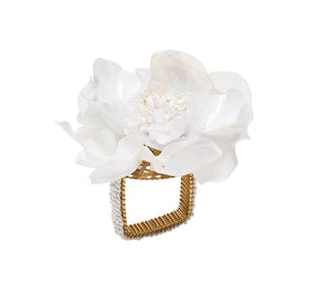 White Gardenia Napkin Ring that resembles the flower, with sequin petals and a beaded base